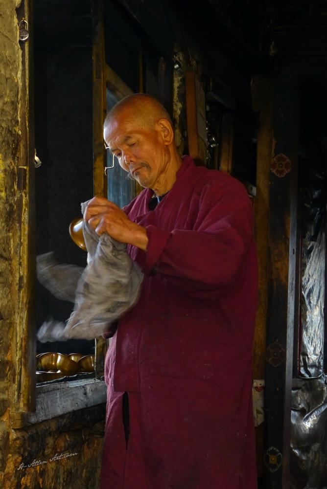 Monk Polishing Copper, Monastery; Tiger's Nest, Paro, Bhutan Monk Polishing Copper, Monastery; Tiger's Nest, Paro, Bhutan